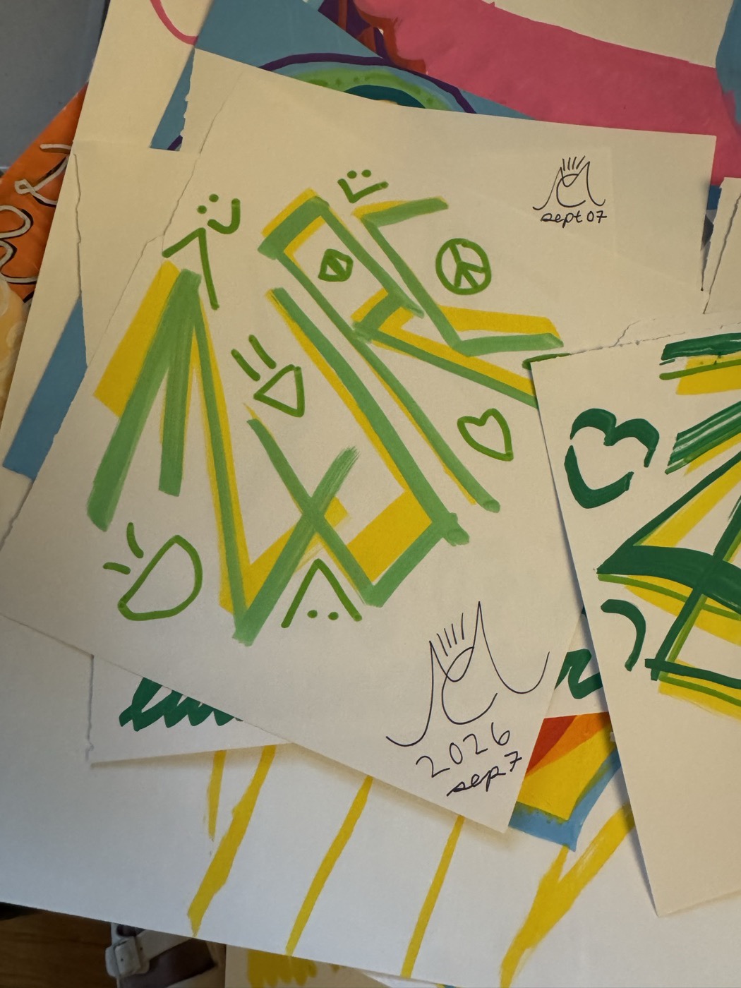 ZURC in green and yellow marker with small faces and a peace sign, signed with a monogram